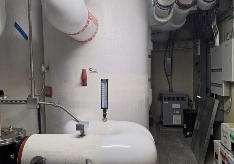 Large insulated pipes in utility room